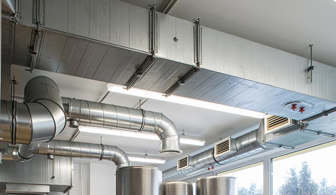 Commercial HVAC ductwork system mounted on a ceiling