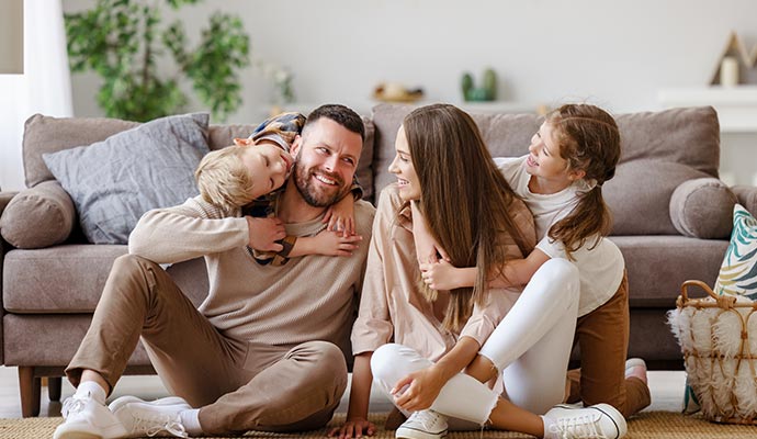 Happy family enjoying indoor air quality inside living room