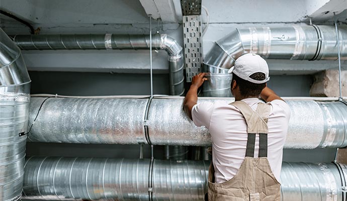 Professional air duct sealing for new restaurant construction.
