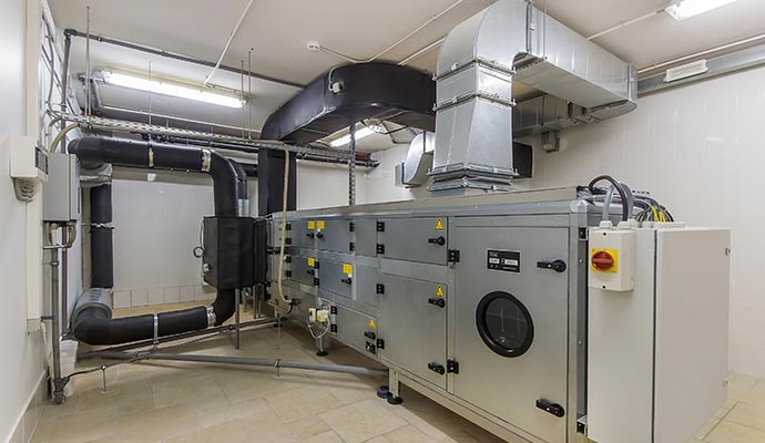 Commercial air handling unit in mechanical room