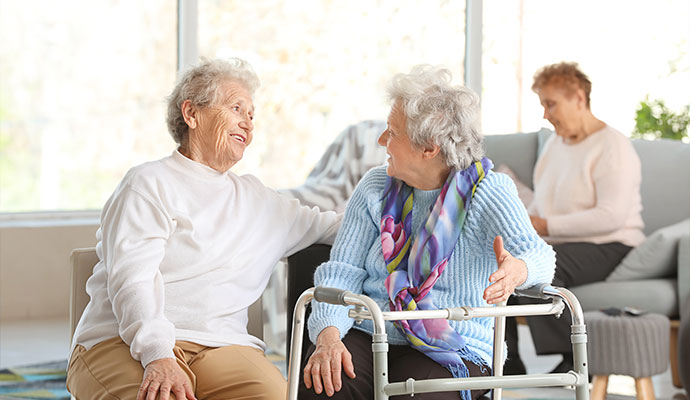 Elderly women talking in nursing home