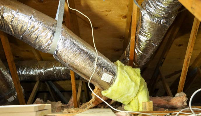 Insulated flexible HVAC ducts in an attic space