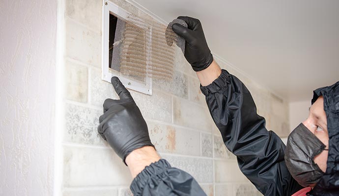 man removing and cleaning service dirty air filter