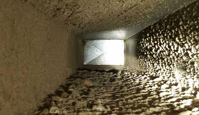 Severely contaminated HVAC air duct with heavy mold and dust