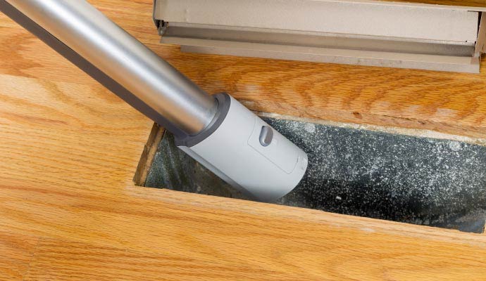 Vacuum cleaning an air duct