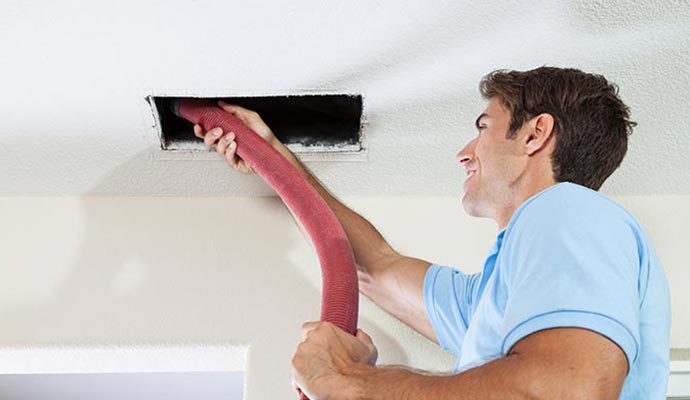 worker cleaning duct in Halethorpe