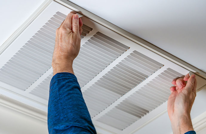 Worker opening air vent