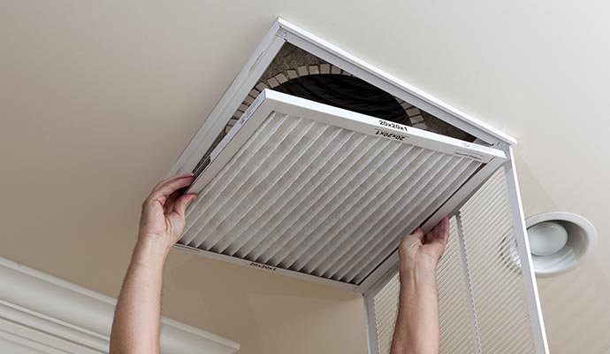 worker opening and air duct cleaning